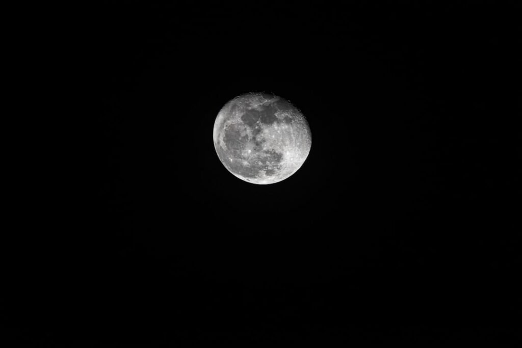 Low golden full moon glowing in a dark sky, illustrating the Strawberry Moon and solstice ritual in June